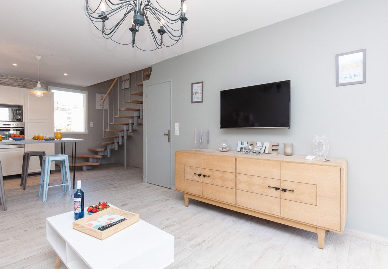 bright living room with modern open-plan kitchen