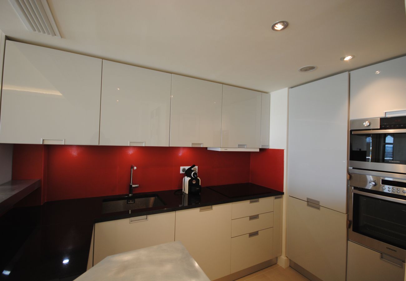 fully equipped American kitchen open to the living room