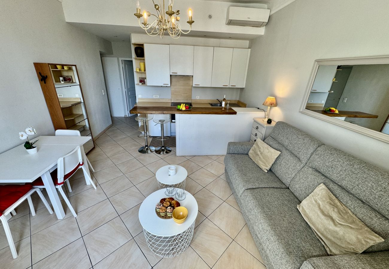 Bright living room with dining area at the back